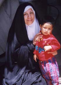 Dr. Bayan Alaraji with young Baqir